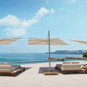 Umbrosa Versa PX parasols with mobile flat base on a sleek design terrace