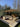 Umbrosa Versa PX in Sand with Grey Beige frame over a boho lounge terrace